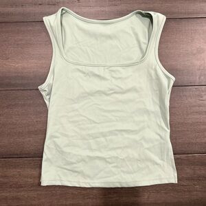 Light green, tight top loose towards lower stomach